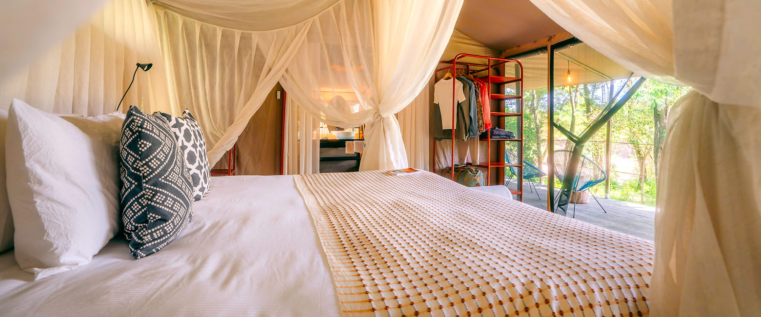 is a secluded riverside tented camp in the Maasai Mara 