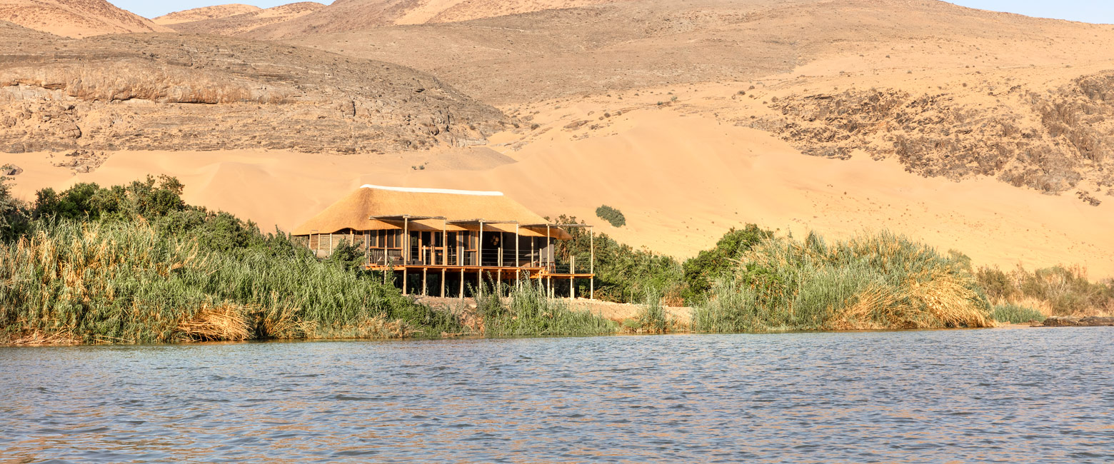is a wild desert area with Himba tribespeople